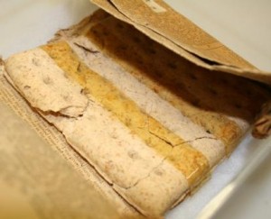 Ration biscuit from the Boer War wrapped in pages of The Glasgow Herald dated 13th October 1900.