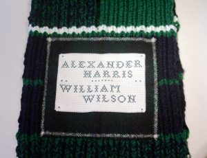 The names of Alexander Harris and William Wilson were added to the scarf, fixed to the same piece of Douglas tartan cloth