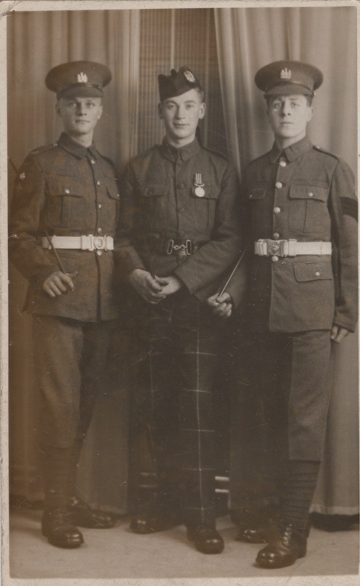 Rifleman McBride, centre, wearing the Military Medal